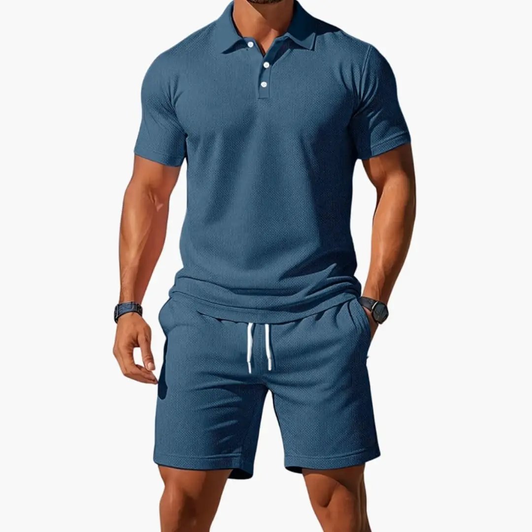 Men's two-piece polo shirt and shorts set in blue with textured fabric and drawstring waist.