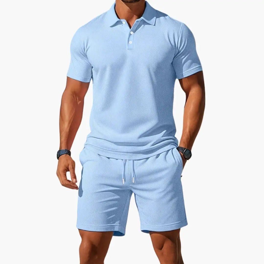 Men’s two-piece polo short set by Wilfred Smith: light blue collared polo shirt with matching shorts.