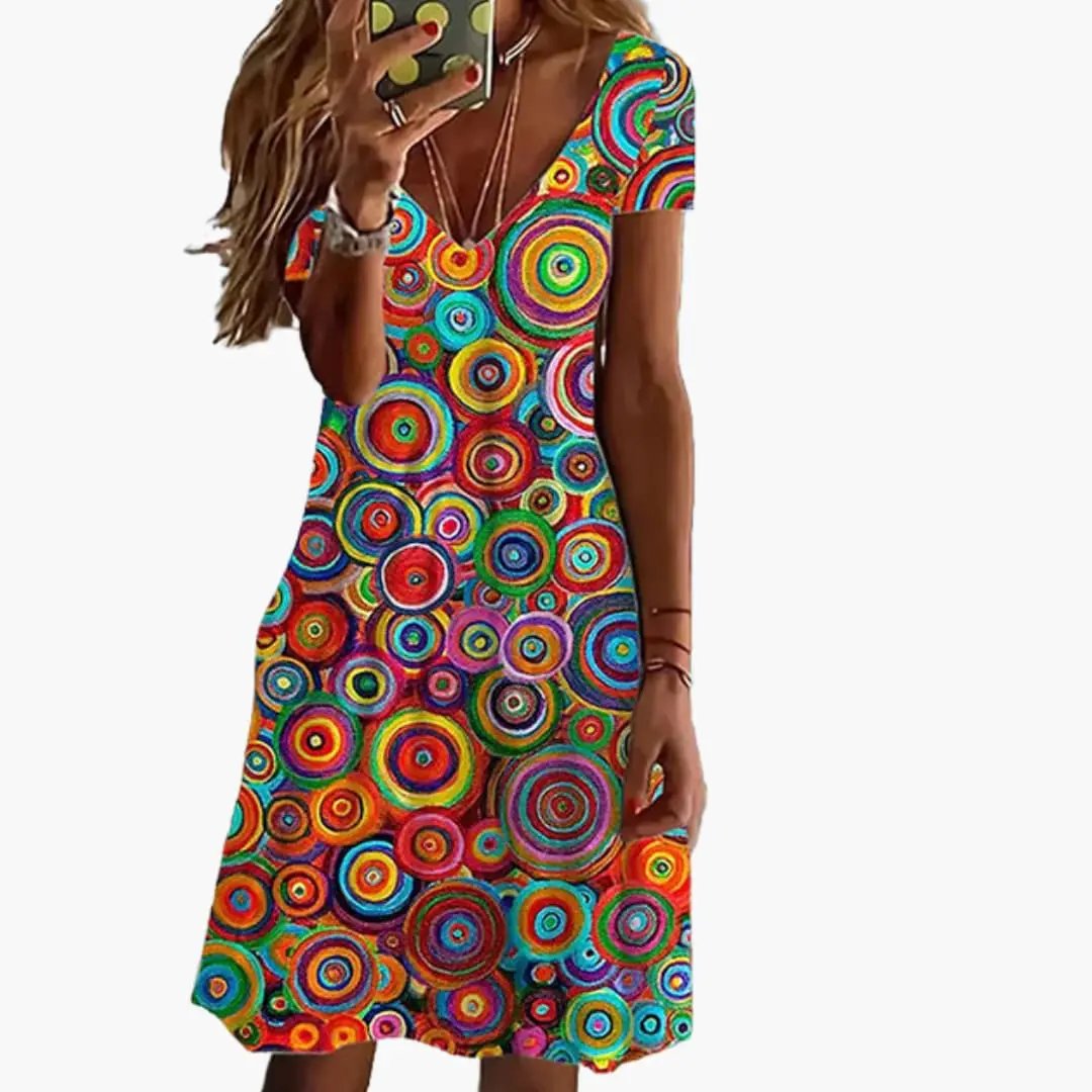 Women’s Abstract Print Dress by Wilfred Smith with round neckline in vibrant multicolor circular pattern