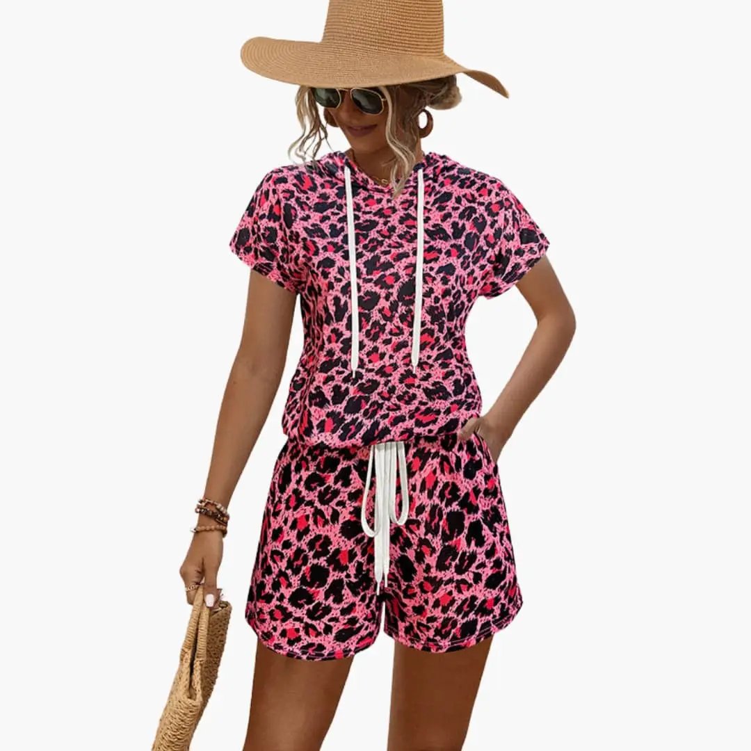 Wilfred Smith women's animal print hooded top and shorts set; pink leopard print two-piece outfit with drawstrings