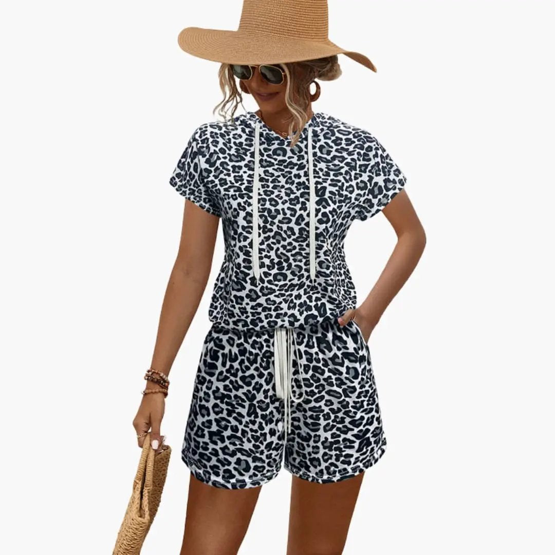 Women's two-piece animal-print hooded top and shorts set in black and white leopard by Wilfred Smith.