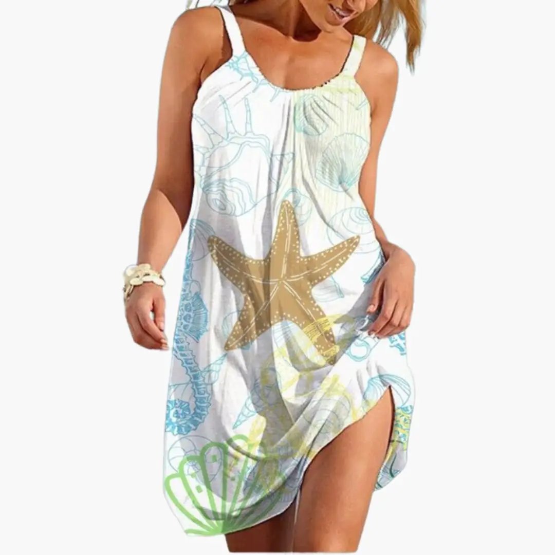 Women’s knee-length sleeveless beach dress in white with a large starfish sea-life print.