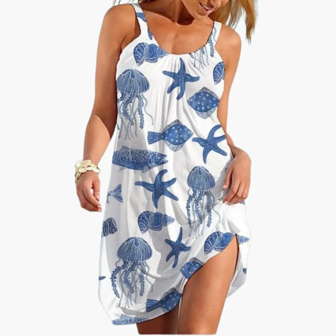 Women's sleeveless beach dress in white with blue sea-life print, knee-length