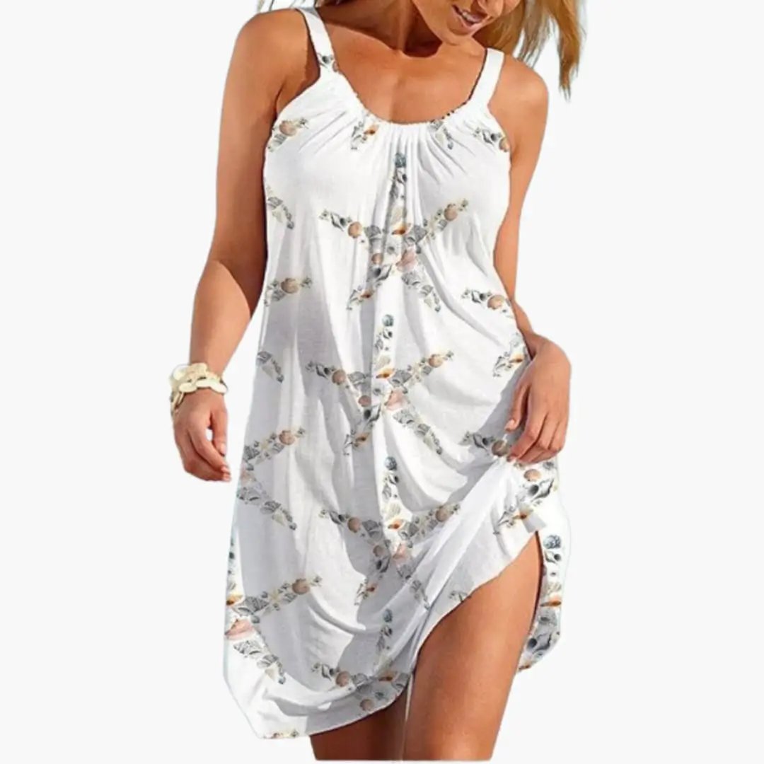 Women's beach dress by Wilfred Smith, sleeveless white knee-length with floral print