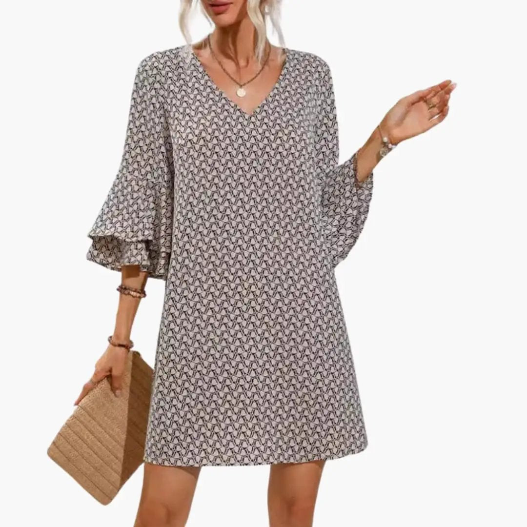 Wilfred Smith women's beach dress with V-neck and wide sleeves in a gray geometric print.