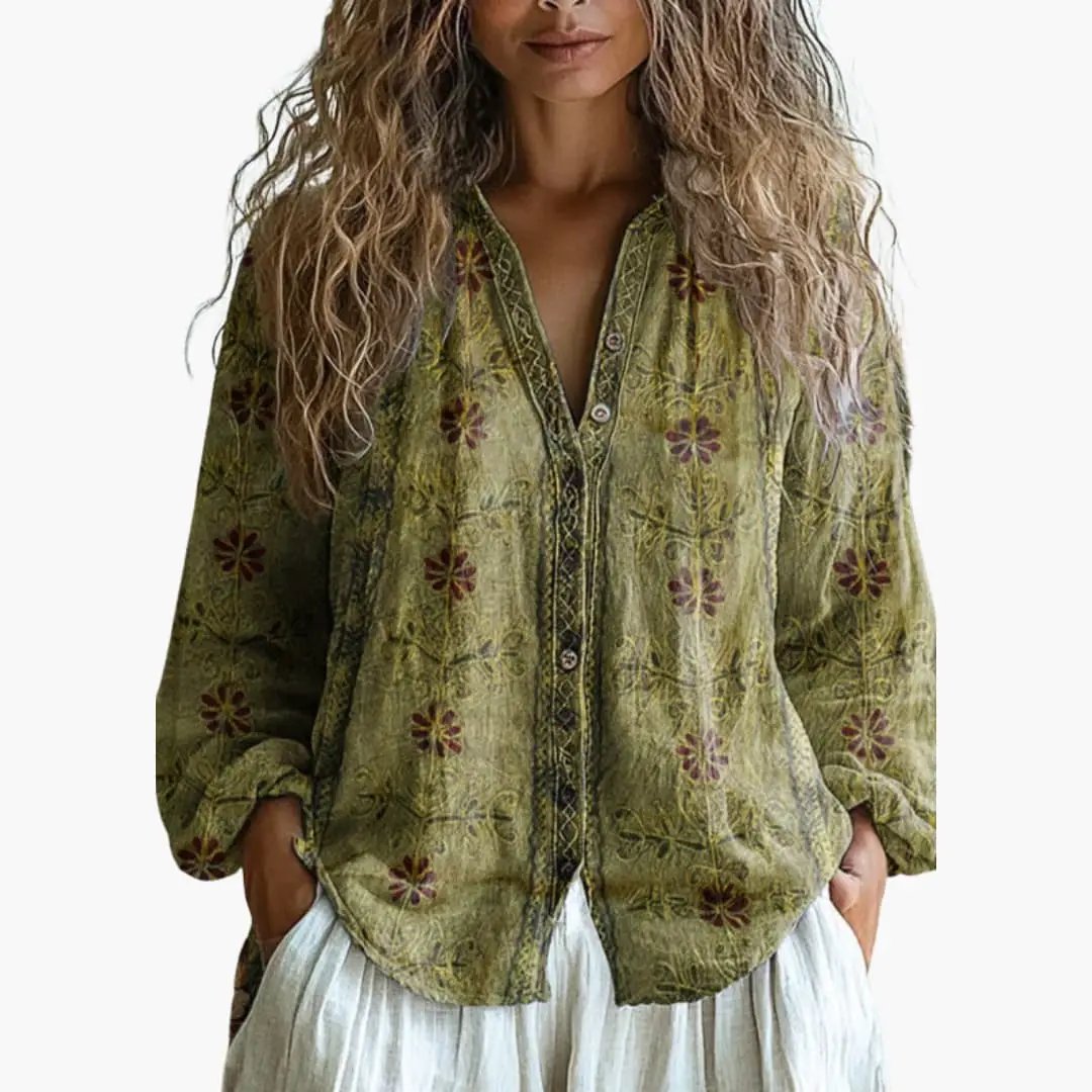 Women's blouse with olive-green floral print and button-front closure.