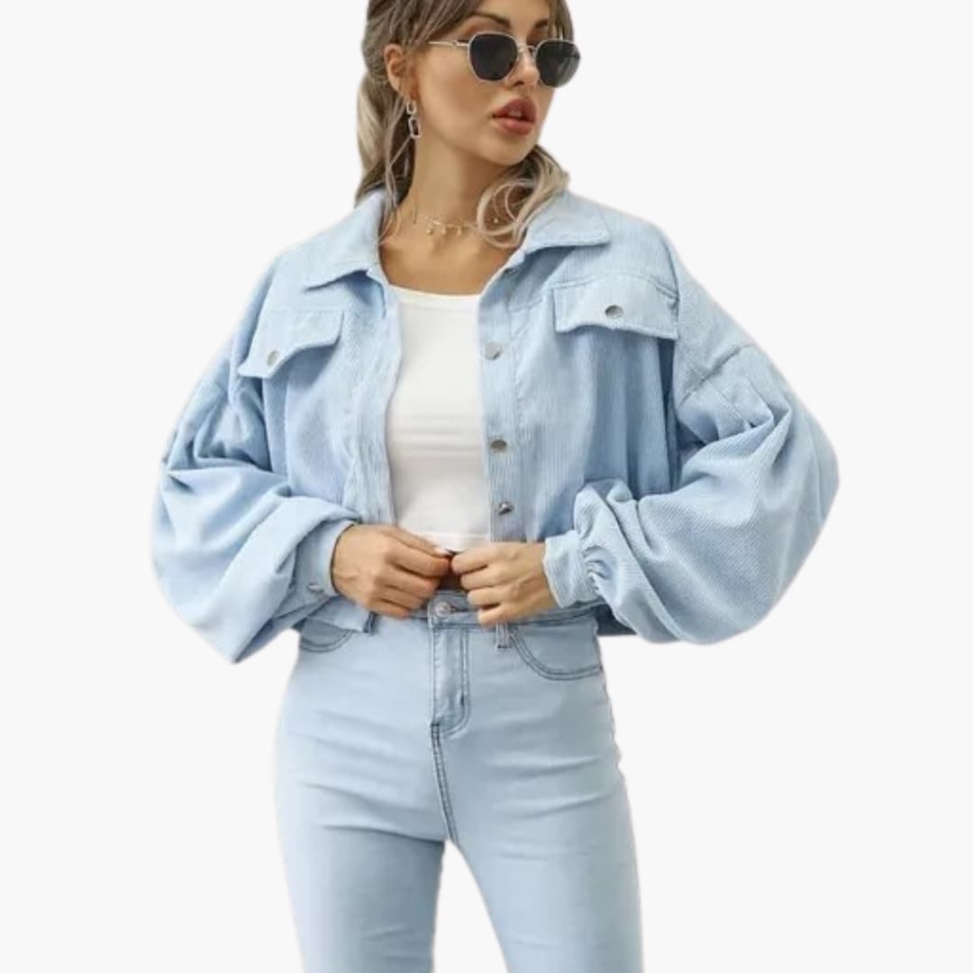 Women's bomber jacket in light blue denim with oversized puff sleeves and button-front.