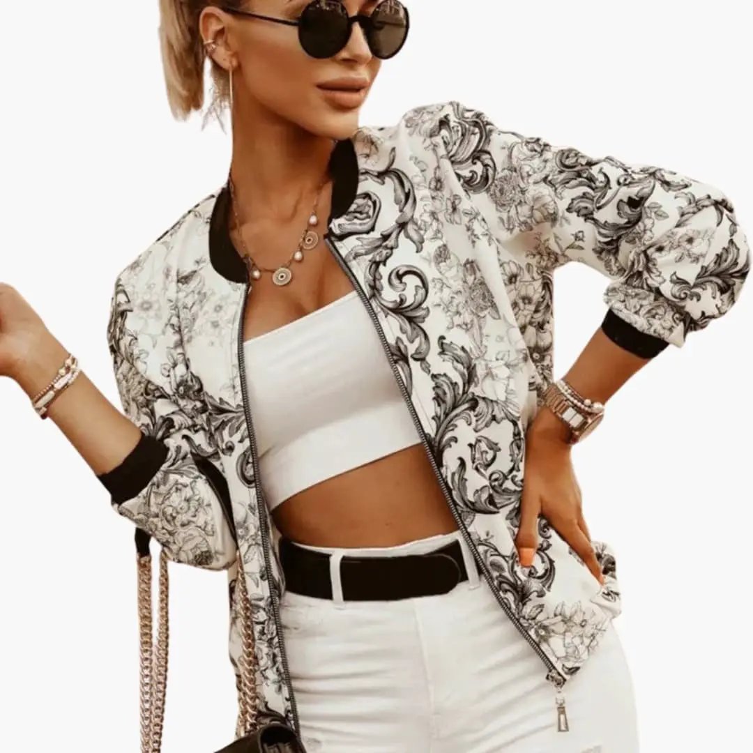Women’s bomber jacket by Wilfred Smith in white with black floral print, front zip, round collar, side pockets.