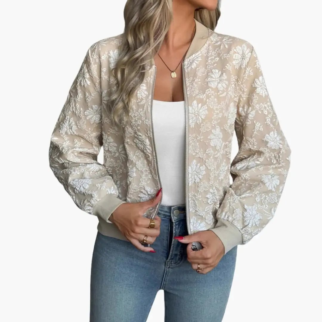 Women's bomber jacket by Wilfred Smith, beige with white floral embroidery and zip front.