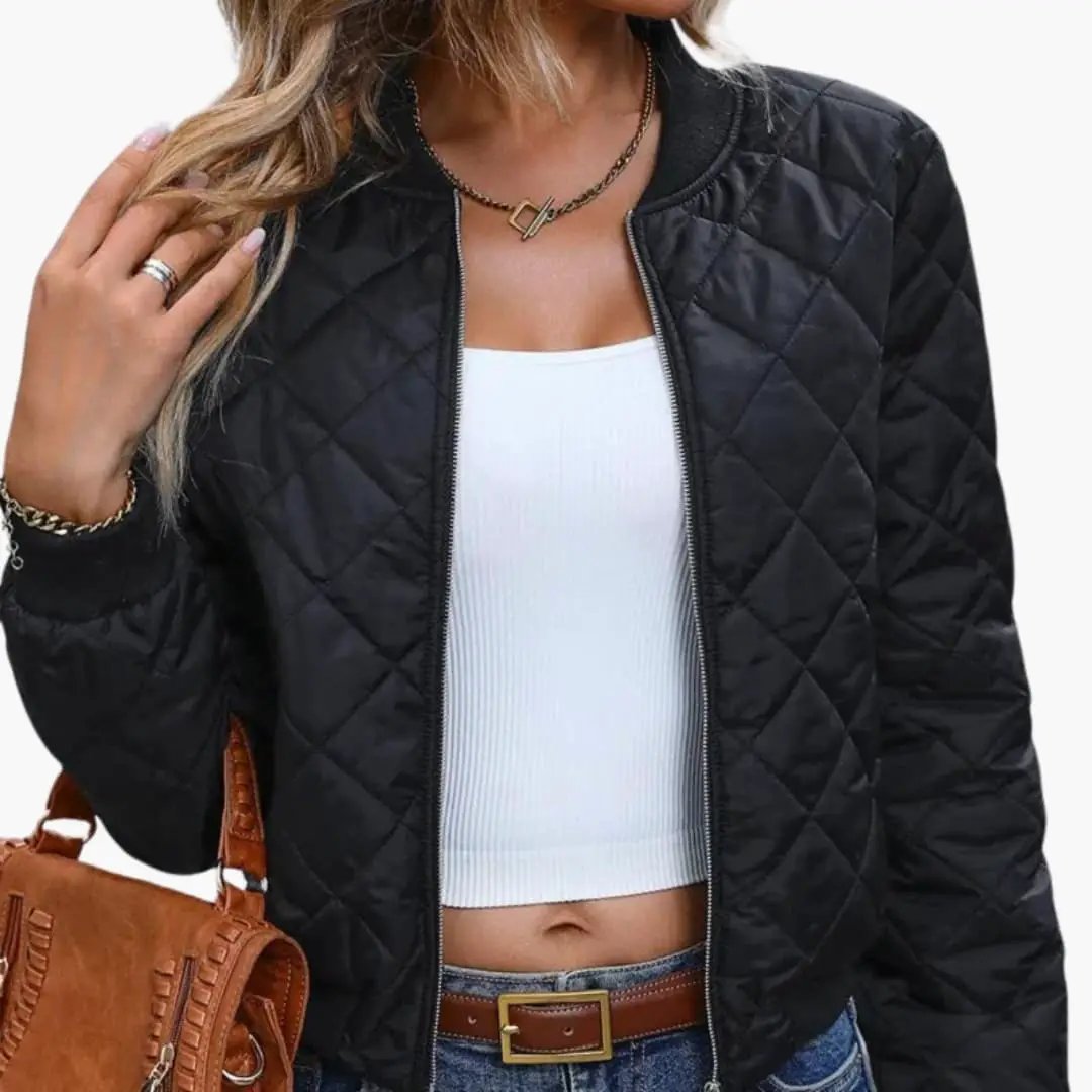 Women's quilted black bomber jacket with zip closure and ribbed hem.