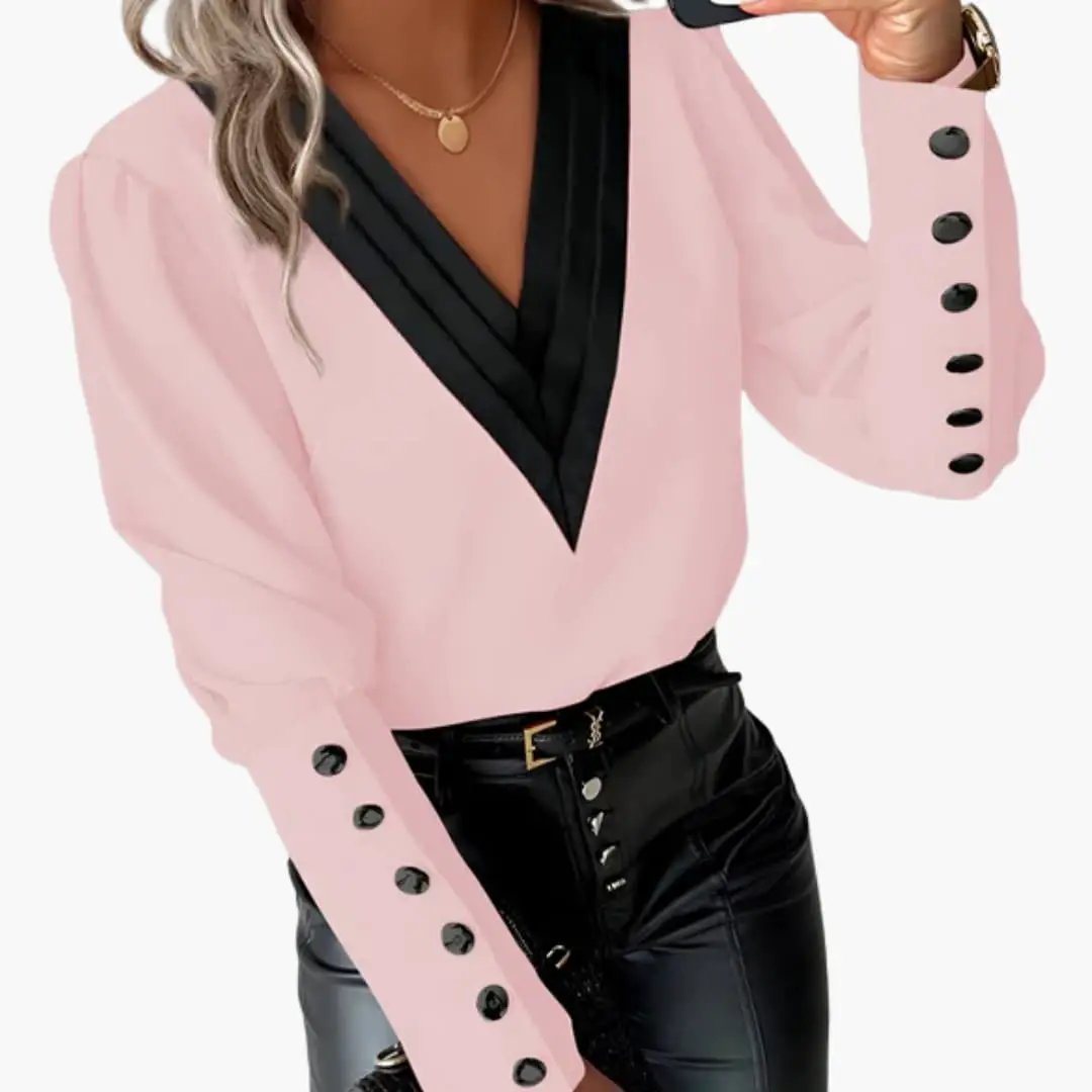 Women’s pink color-block woven blouse with black V-neck, long sleeves and buttoned cuffs