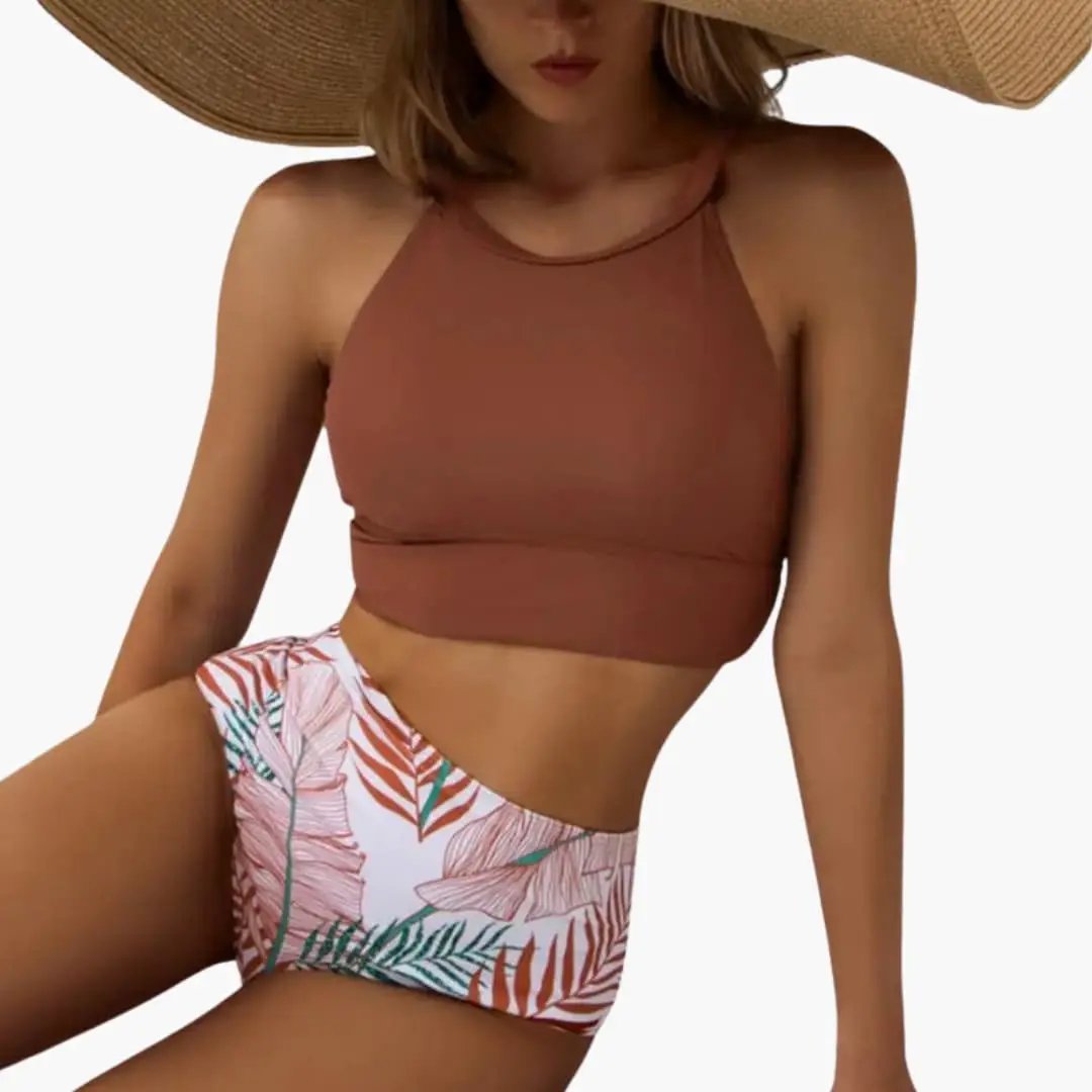 Women’s bikini set: brown high-neck top with tropical floral high-waisted bottom.