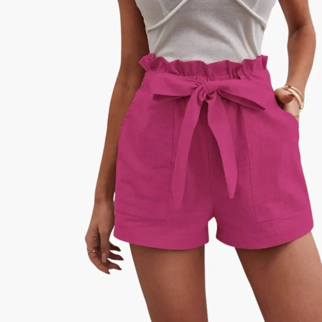 Women's high-waisted pink shorts with drawstring waist and pockets.