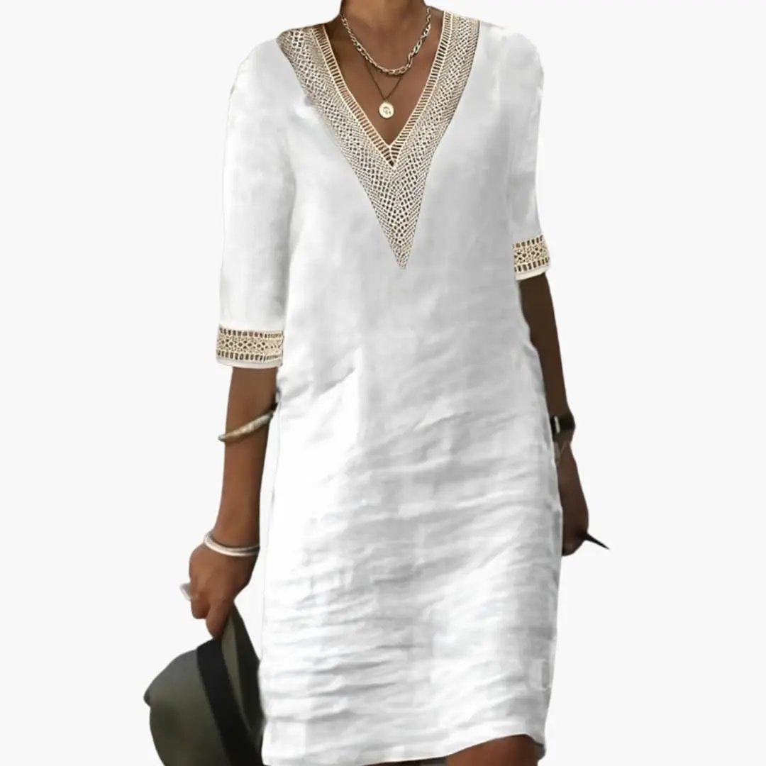 Women's knee-length dress by Wilfred Smith, white fabric with crochet-trim V-neck and lace cuff sleeves.