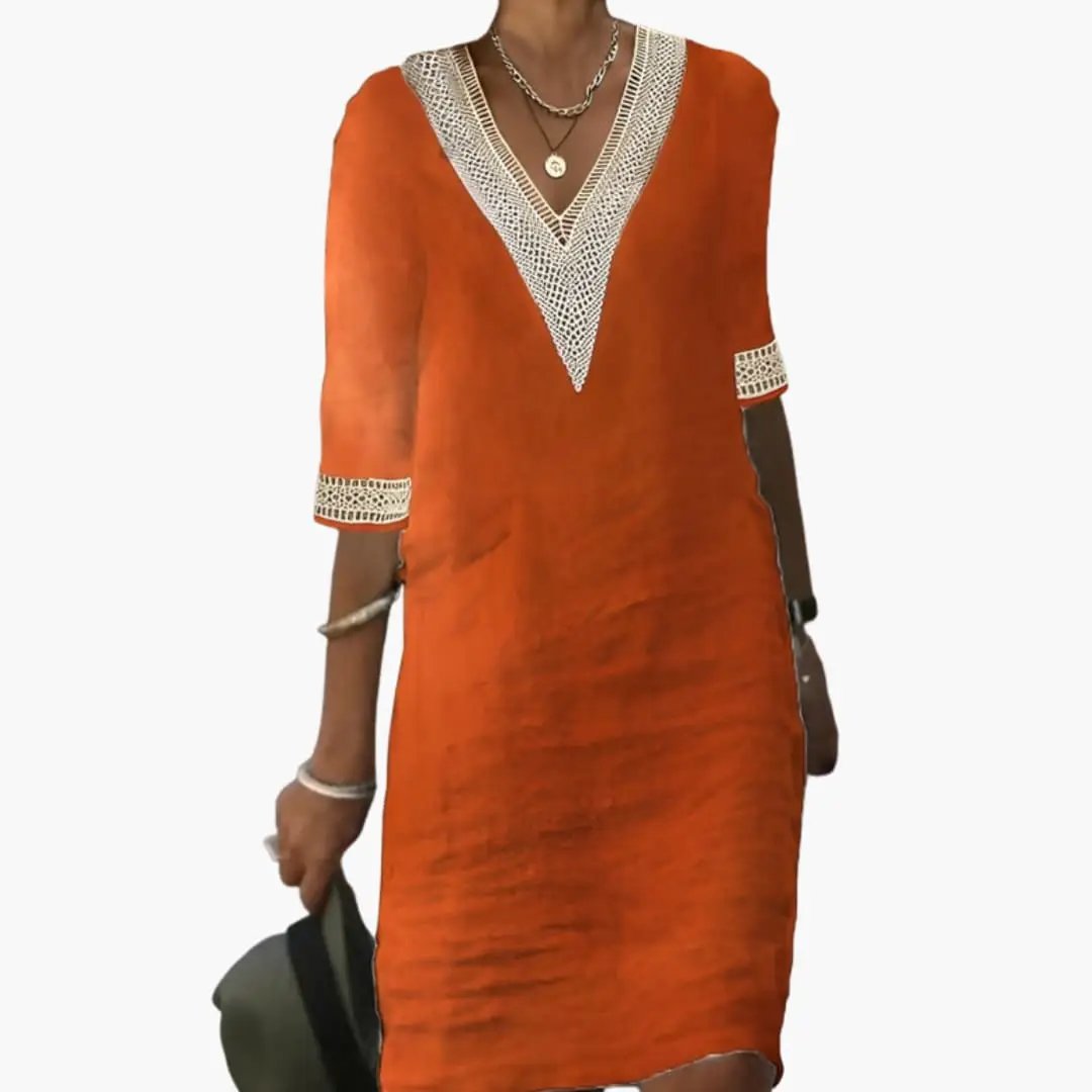 Women's knee-length orange dress with round neck, short sleeves, and white crochet trim.