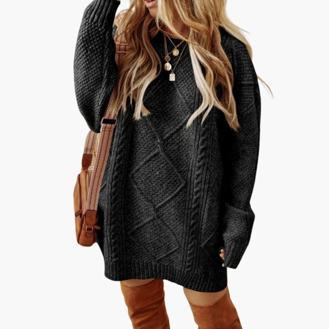 Women's oversized black knit dress with cable detailing and ribbed edges by Wilfred Smith