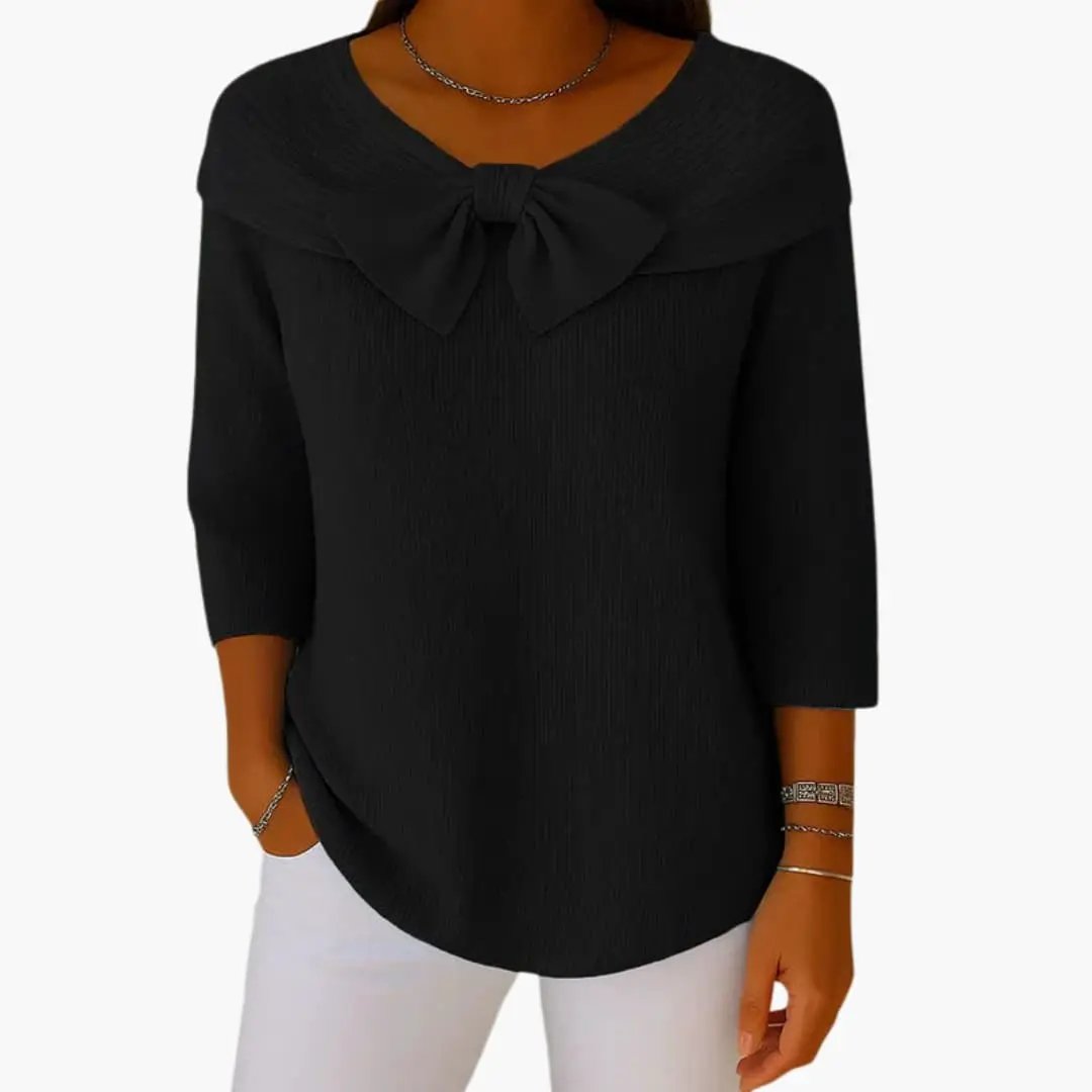 Women's knitted top in black with a bow neckline and three-quarter sleeves.