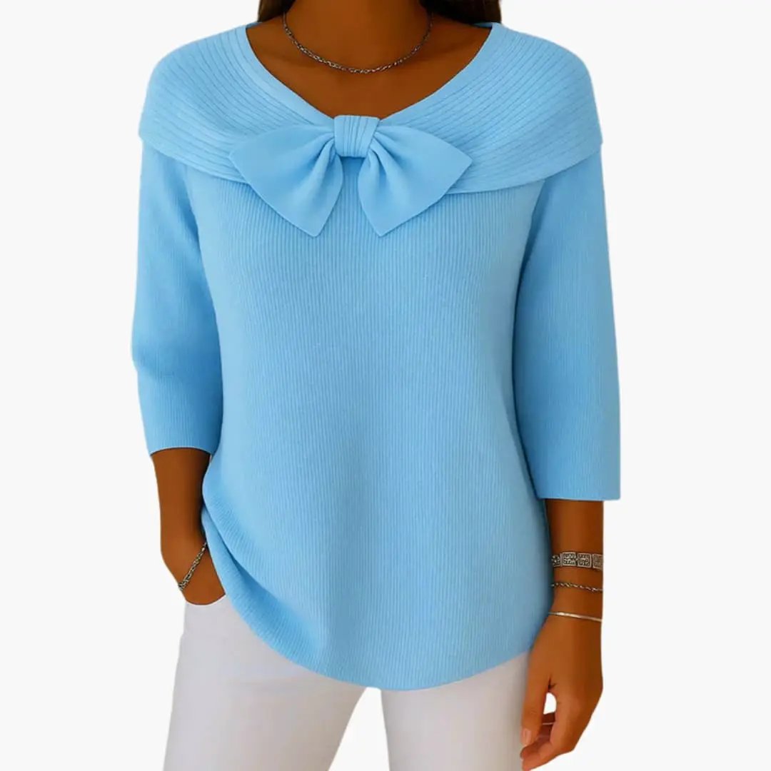 Women's knitted top in light blue with a bow neckline and long sleeves by Wilfred Smith