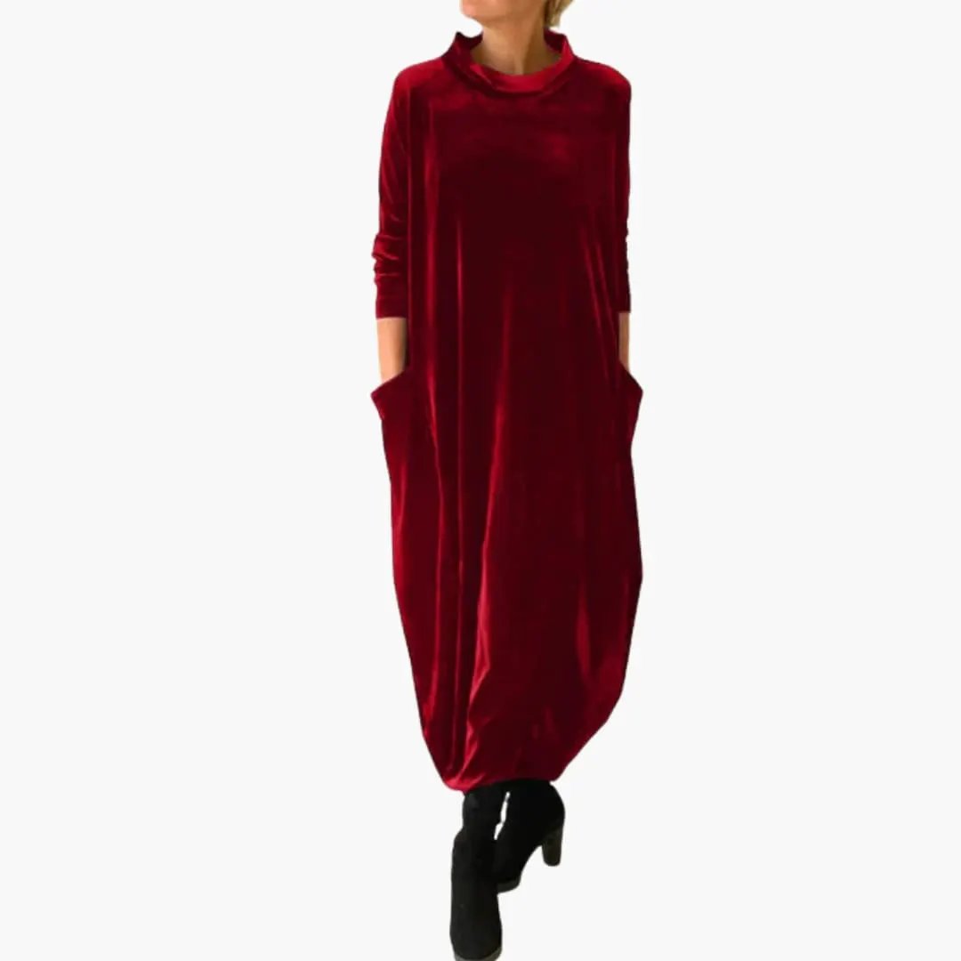 Women's red velvet long-sleeve evening dress with textured material and side pockets.