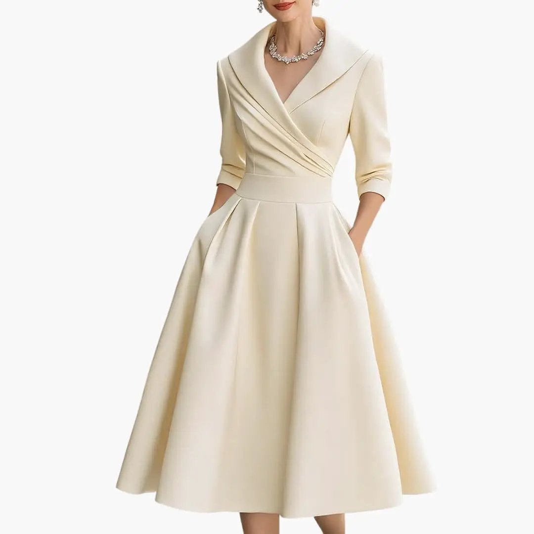 Wilfred Smith women's long-sleeve midi dress in cream with a fitted waist and structured pleated A-line skirt.