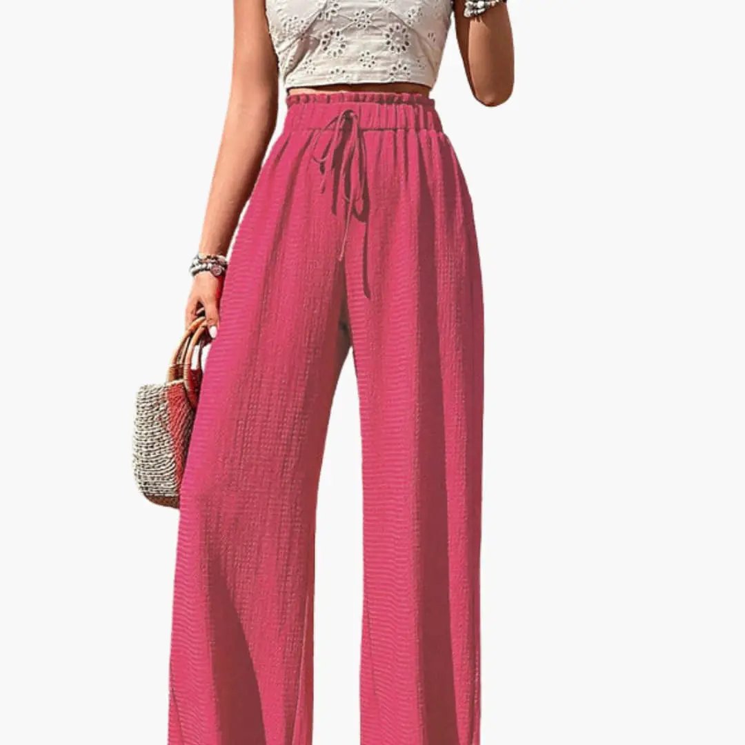 Women’s loose-fit pink wide-leg pants with elastic waistband and drawstring
