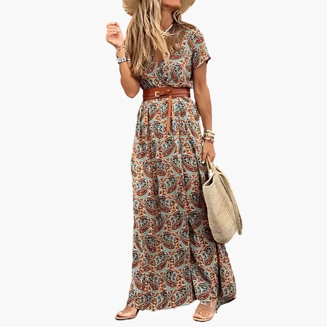 Women’s maxi dress with brown belt, short sleeves, gathered waist in teal-brown paisley print.