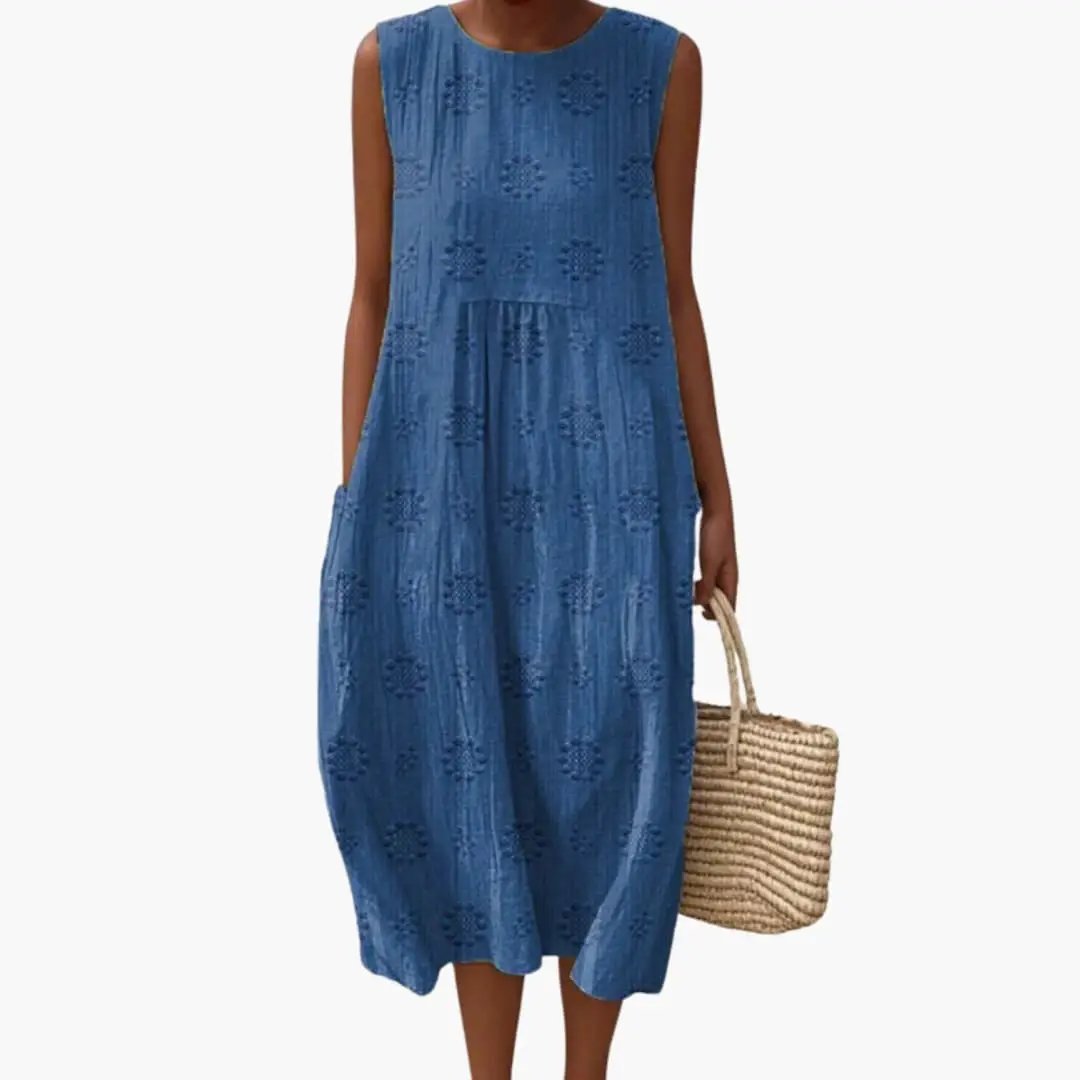 Women's sleeveless blue maxi dress with eyelet pattern and side pockets