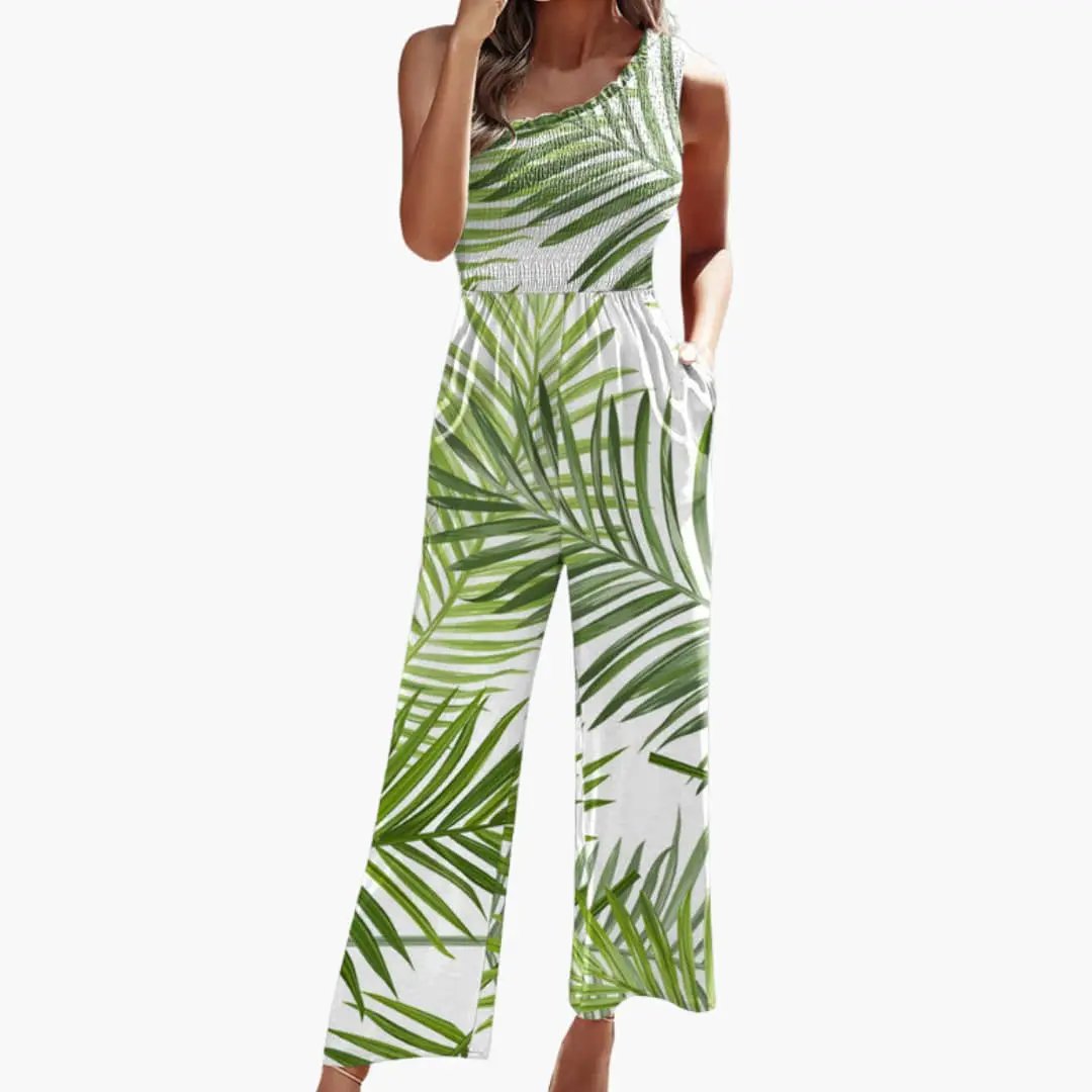Women’s one-shoulder wide-leg jumpsuit in green palm-leaf print on white background, tropical style