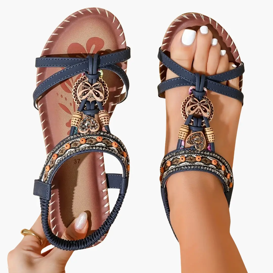 Pair of Wilfred Smith women's orthopedic sandals with navy beaded straps and supportive sole