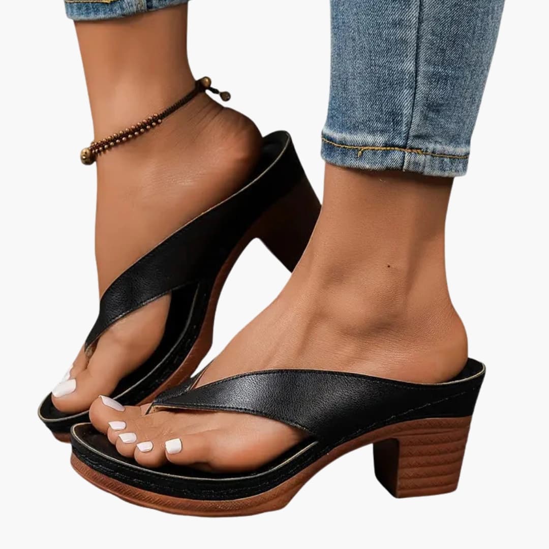 Women's orthopedic sandals with contoured footbed and textured sole, black leather cross-strap and chunky wood heel
