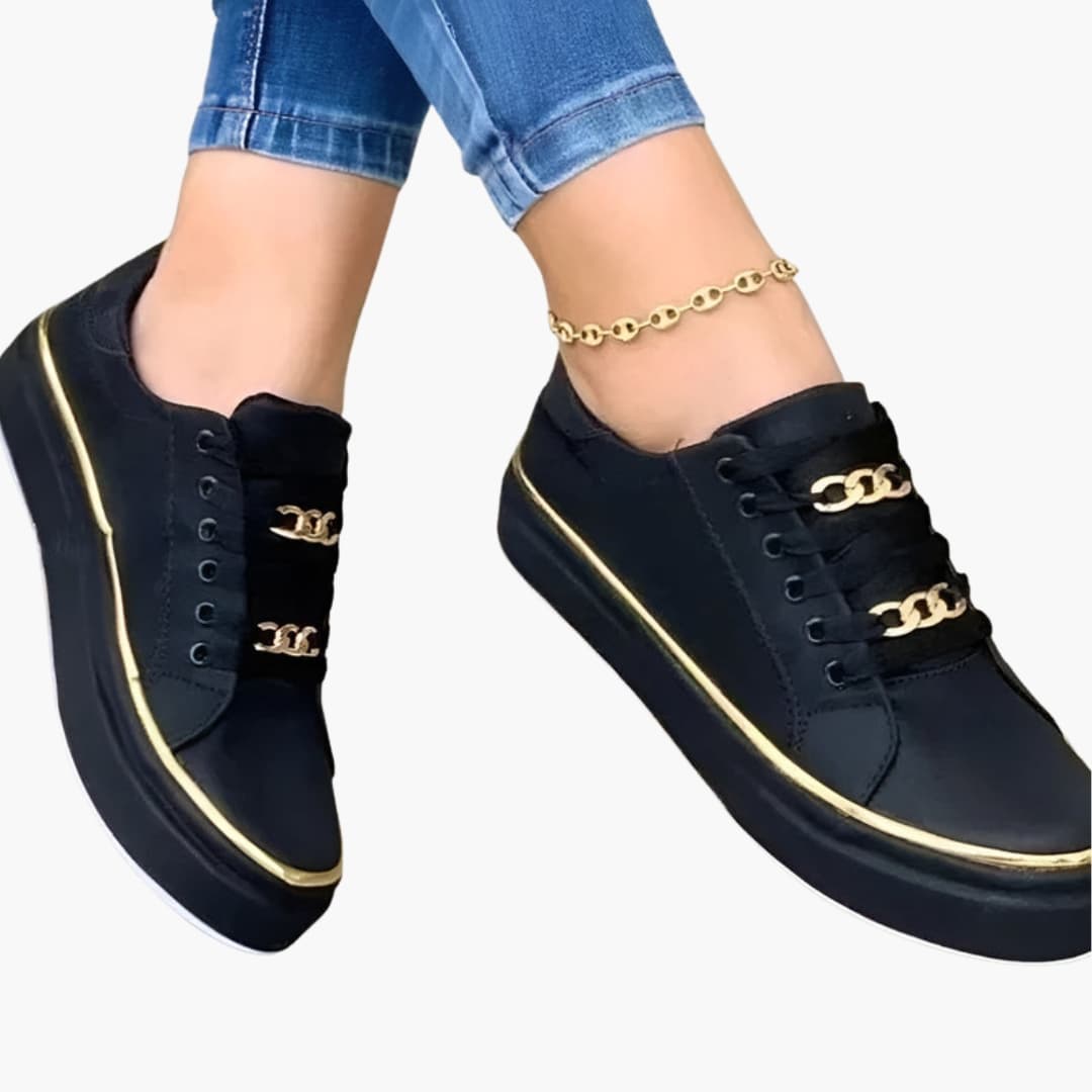 Wilfred Smith women's orthopedic sneakers, black lace-up with gold chain accents and cushioned sole.