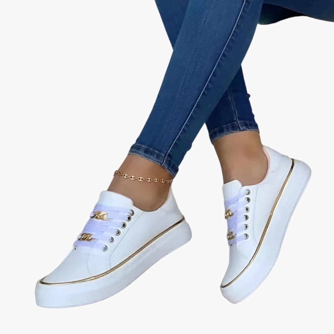 Wilfred Smith women's orthopedic sneakers with lace-up closure, white with cushioned sole and gold accents.