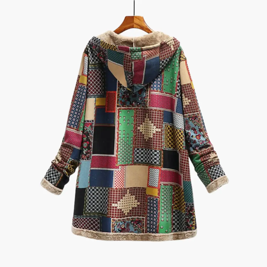 Women's patchwork overcoat with hood, soft lining, and faux fur trim in a colorful quilt pattern