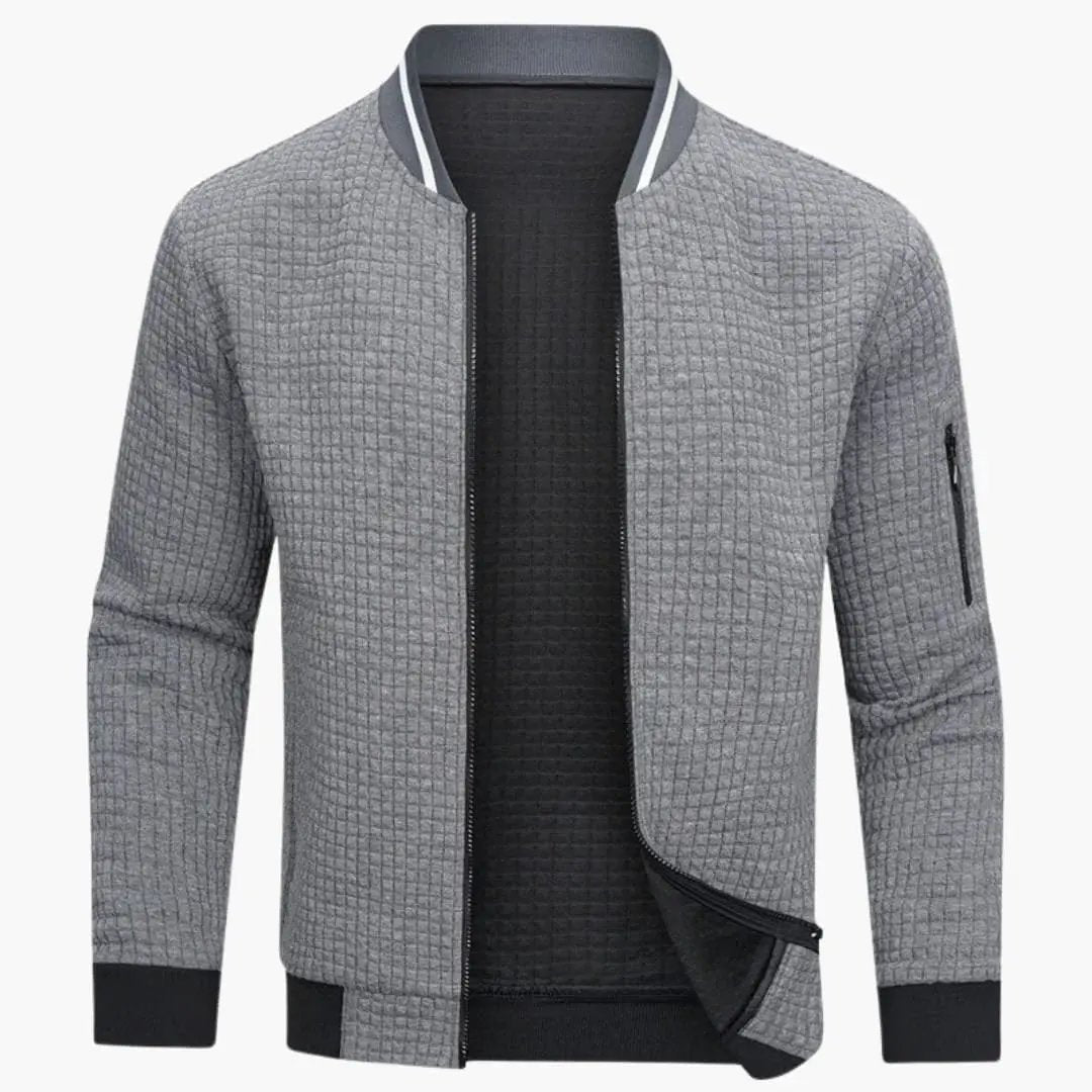 Wilfred Smith Women’s bomber jacket, gray quilted woven design with long sleeves and zip pocket.