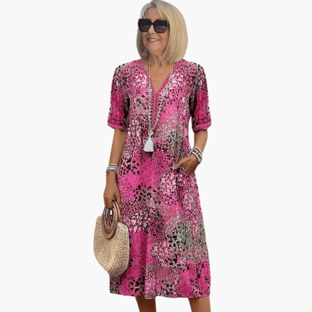 Women’s Printed V-Neck Midi Dress in pink floral print with short sleeves and loose fit