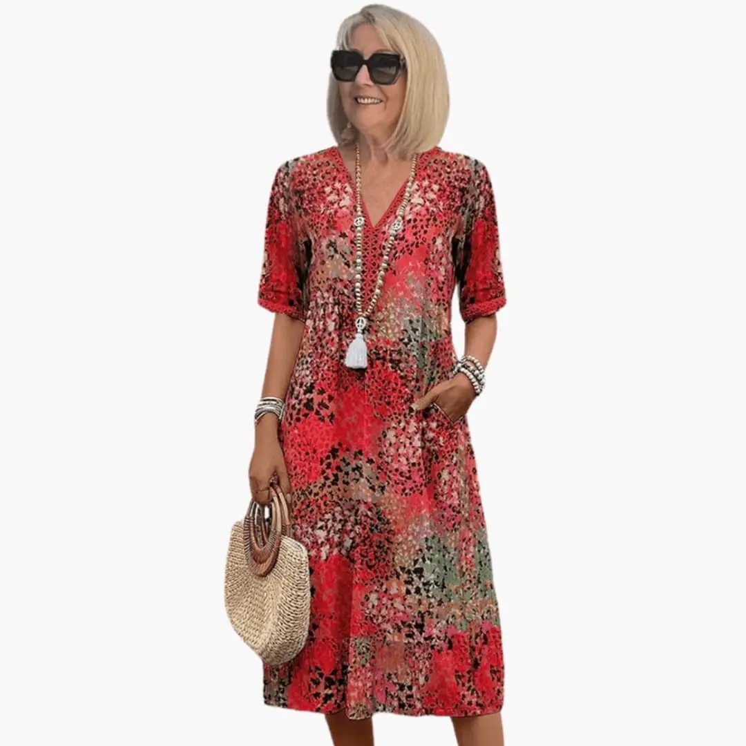 Women's printed V-neck midi dress with short sleeves, loose fit in red floral print by Wilfred Smith