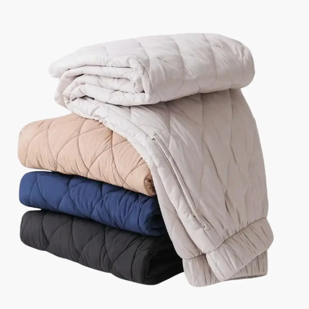 Quilted puffer jackets stacked in white, beige, blue, navy, and black.