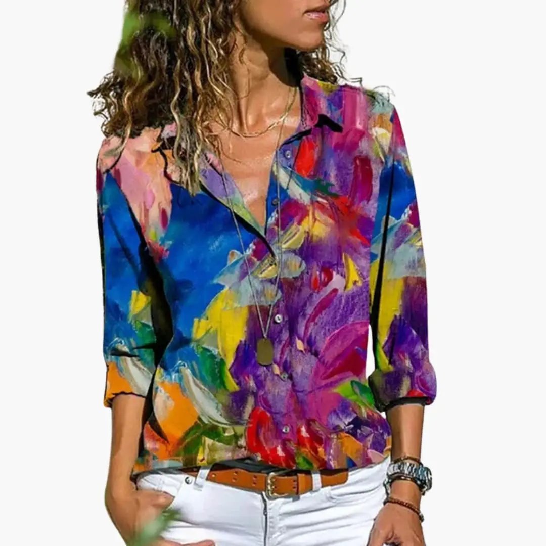 Women’s woven shirt with abstract multicolor print, button-down collar, relaxed long sleeves on model.