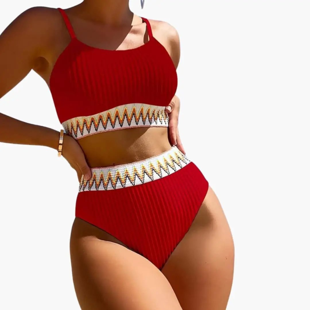 Women’s ribbed high-waisted bikini set with padded crop top in red, zigzag-pattern waistband.