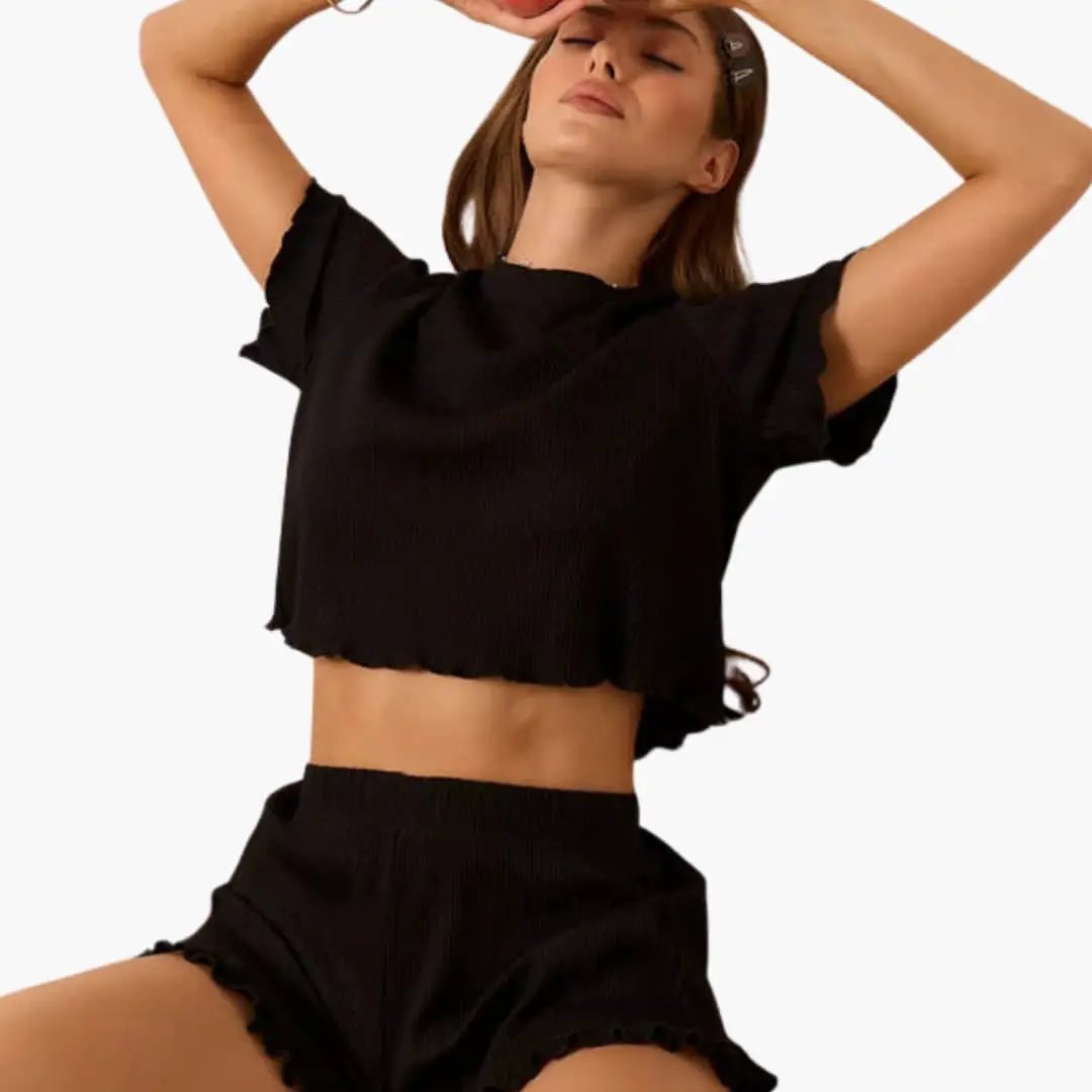 Women's ribbed two-piece set: black ruffle-sleeve crop top with matching high-waisted shorts by Wilfred Smith