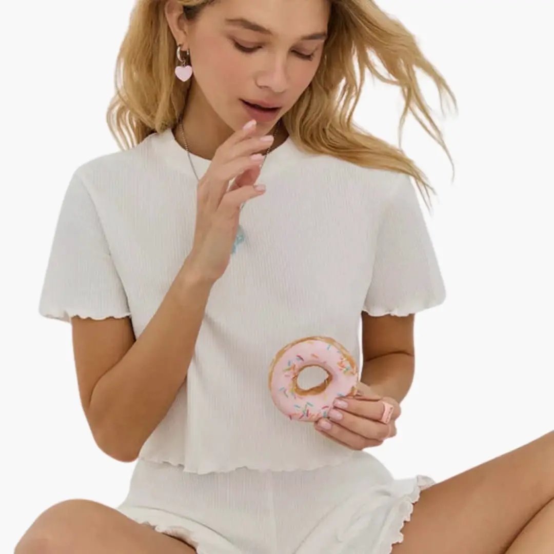 Women's ribbed two-piece set: white ruffle-sleeve top and matching shorts by Wilfred Smith.