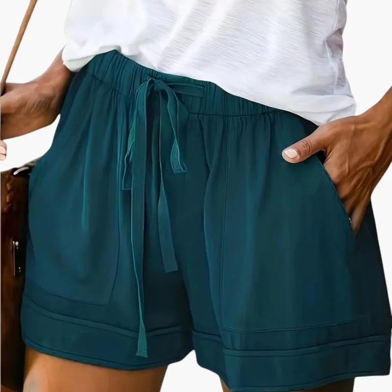 Women's teal jogger shorts with drawstring waist and pockets