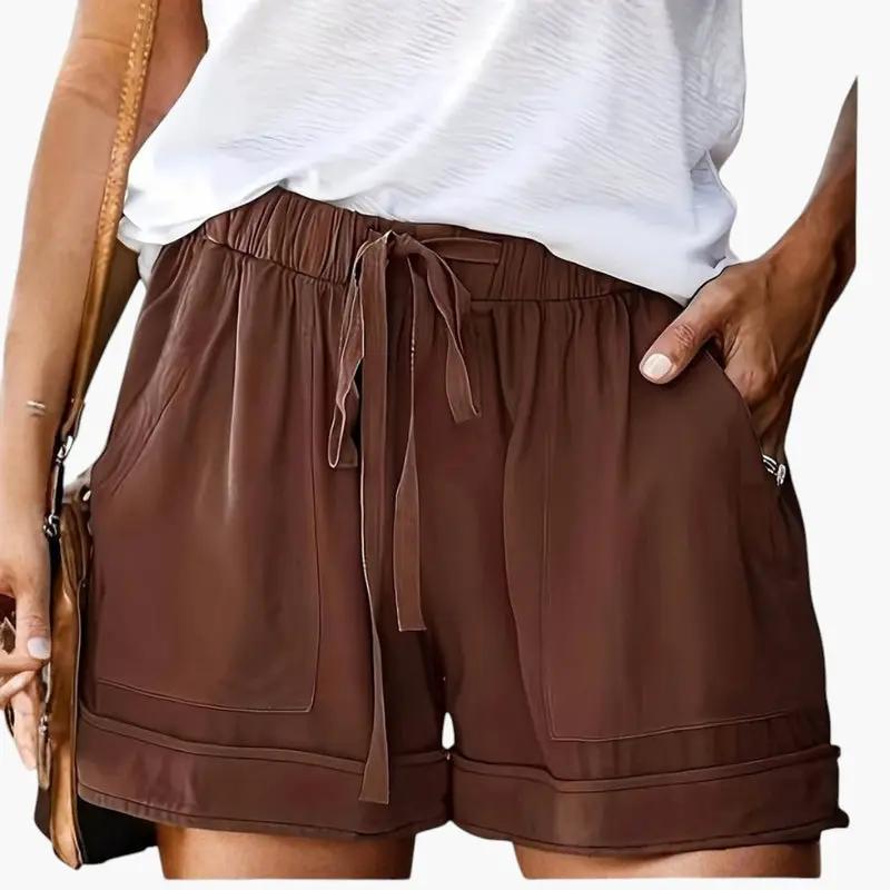 Women's brown faux leather jogger shorts with drawstring waist, front pockets, rolled cuffs