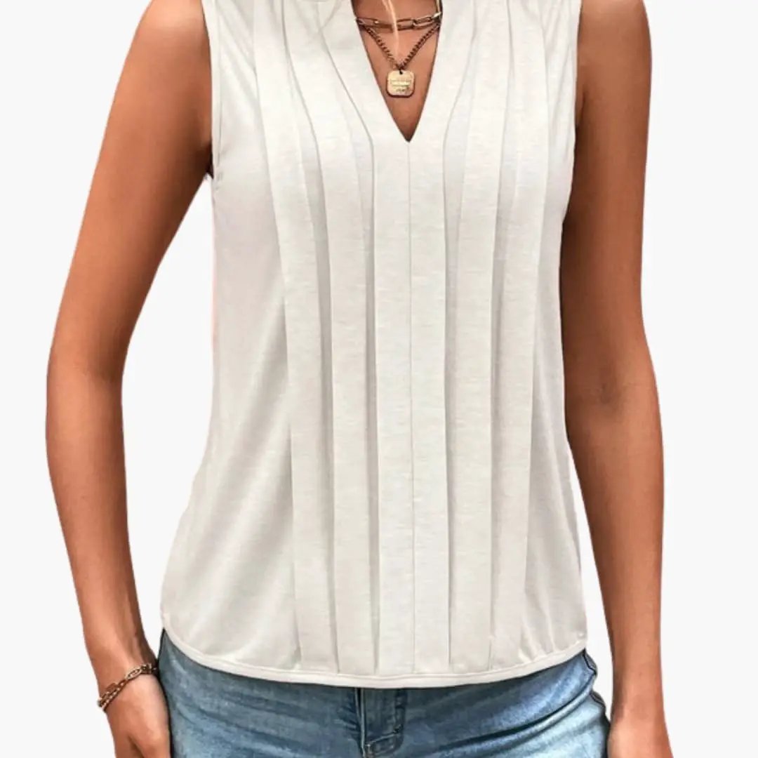 Women's sleeveless blouse by Wilfred Smith with V-neck and vertical pleated front in cream