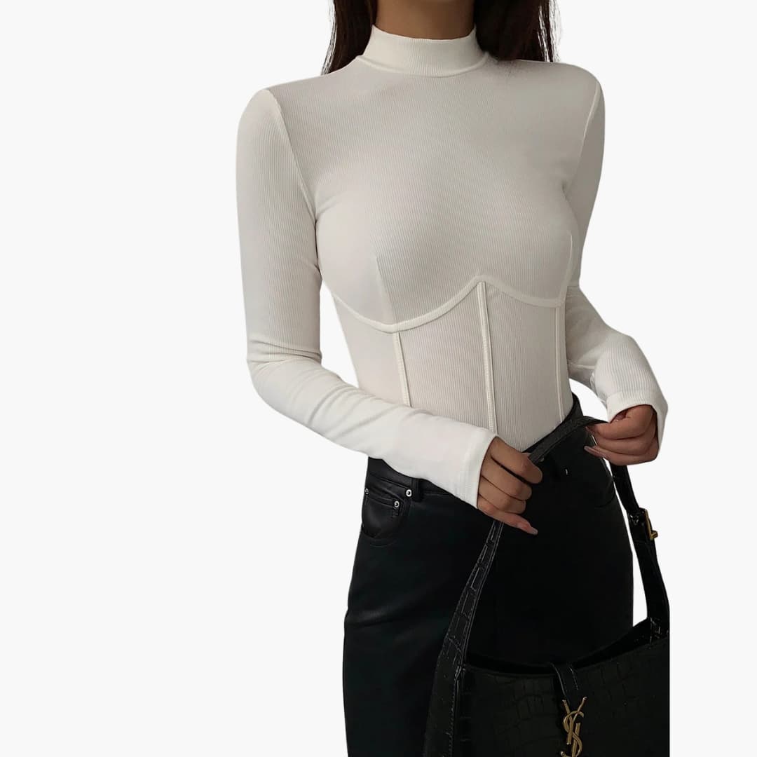 Women's Wilfred Smith slim-fit stand-collar piped top in white, shown with black jeans and handbag.