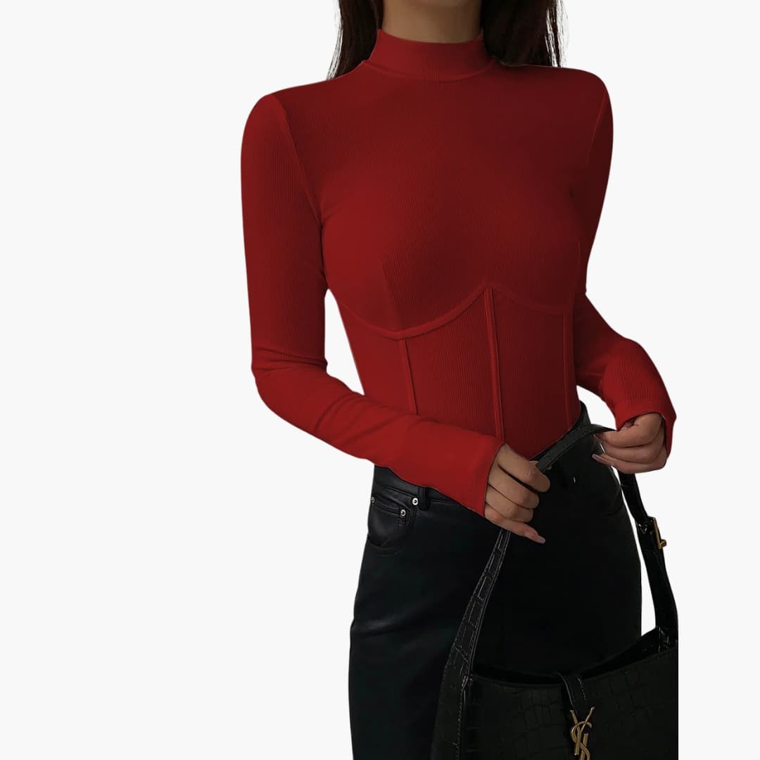 Wilfred Smith red women's slim-fit stand-collar piped top with long sleeves, shown with a black handbag.