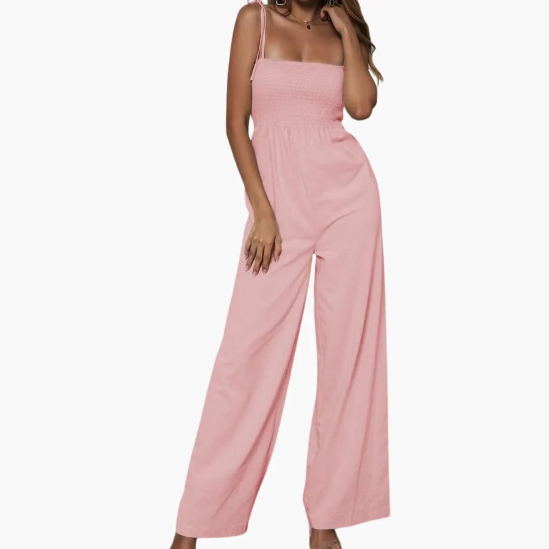Women’s pink jumpsuit with adjustable straps and a smocked top, wide-leg.