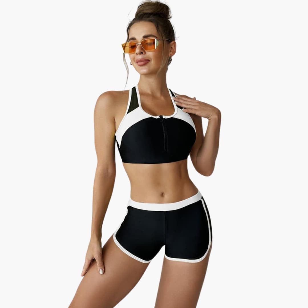 Women’s solid bikini set in black with white trim, two-piece with adjustable straps