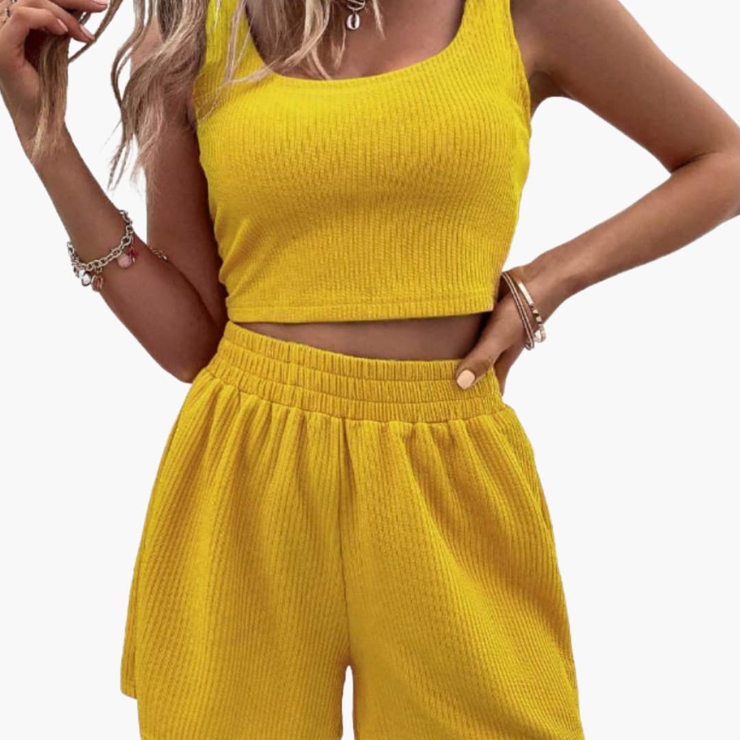 Women's two-piece sporty crop top and shorts set in yellow ribbed knit with pockets