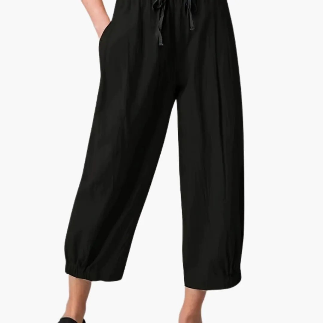 Wilfred Smith women's pants, black loose-fit cropped trousers with elastic waist and cuffed hem.